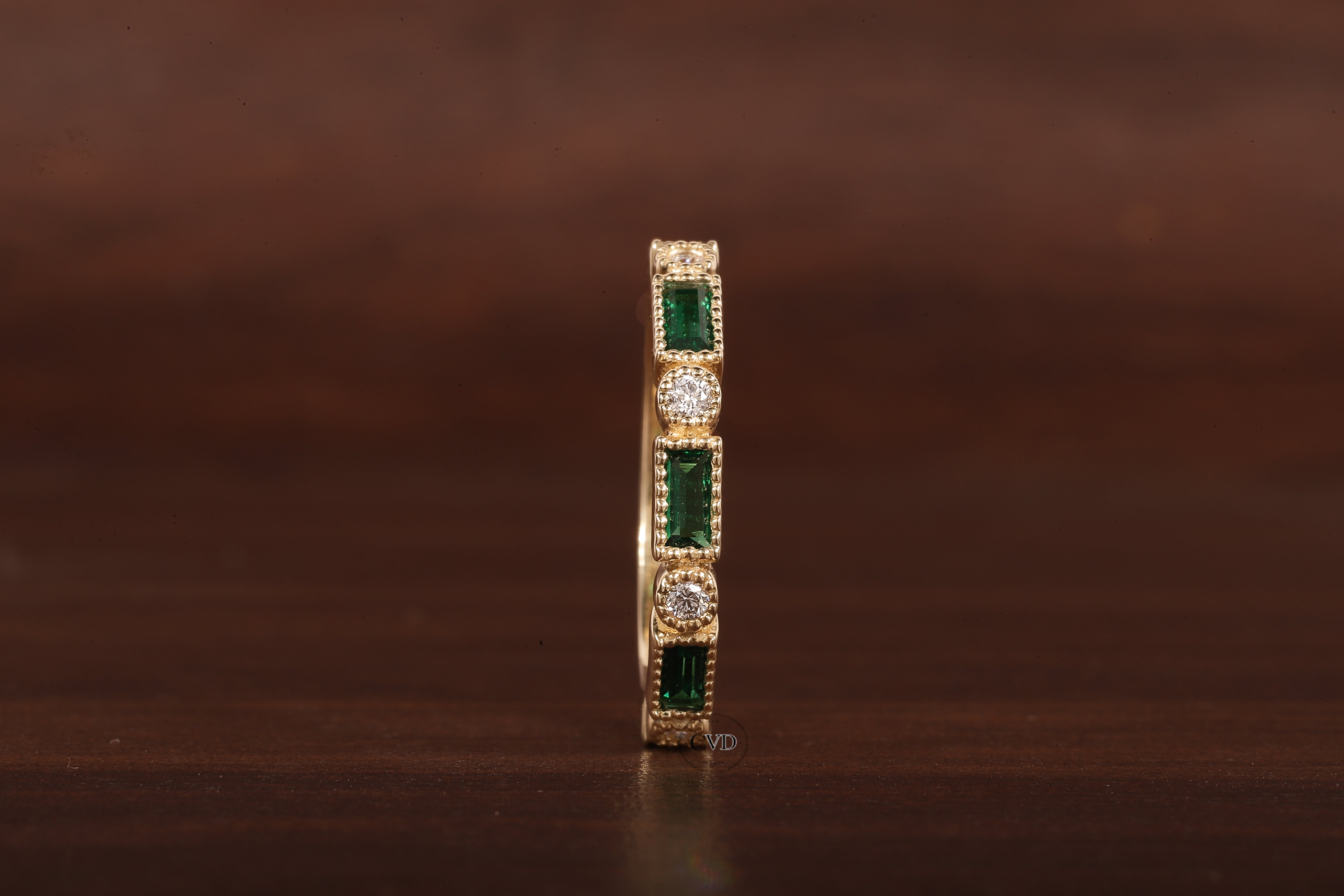 Green baguette and round moissanite milgrain bezel set