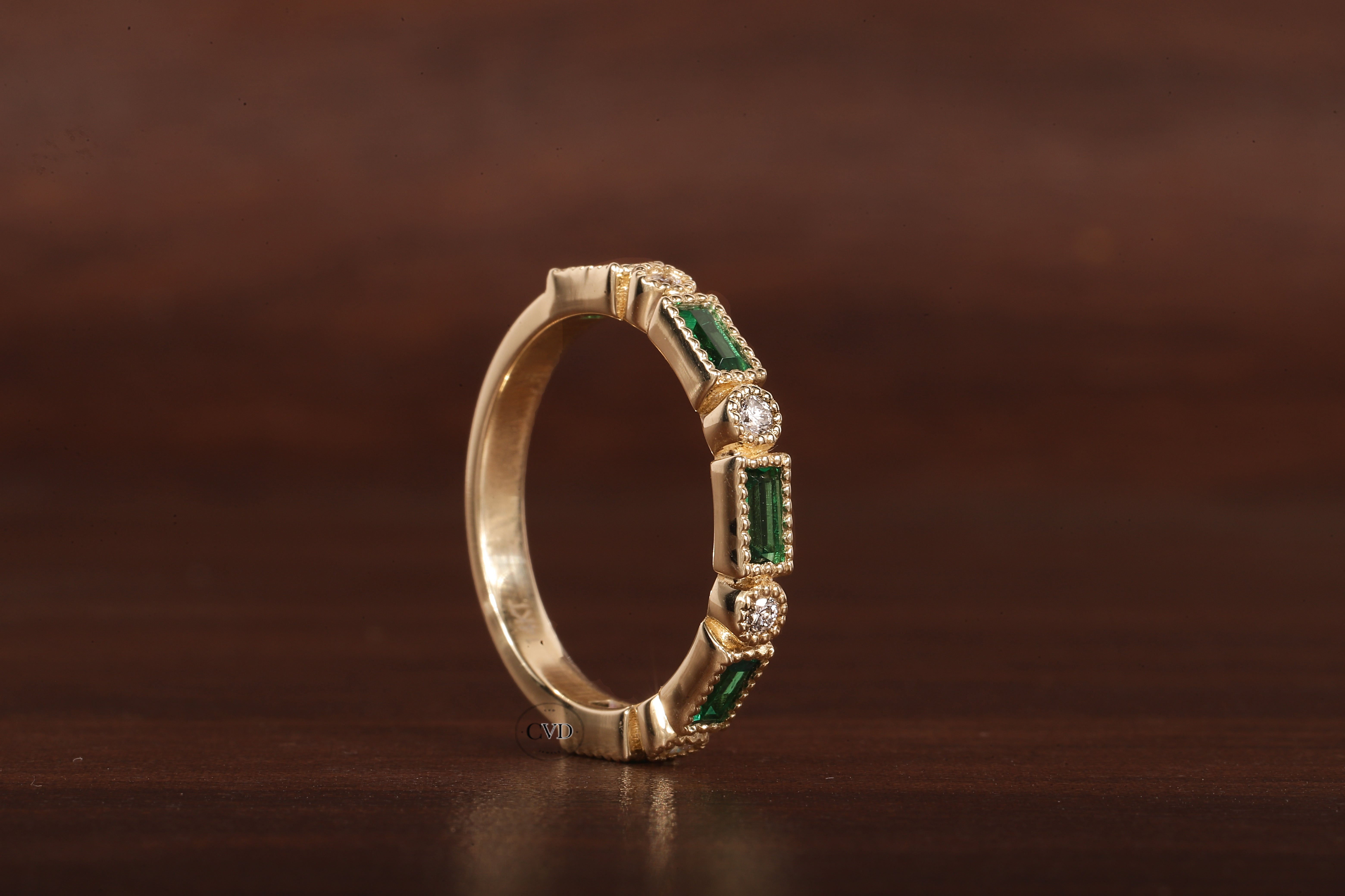 Green baguette and round moissanite milgrain bezel set