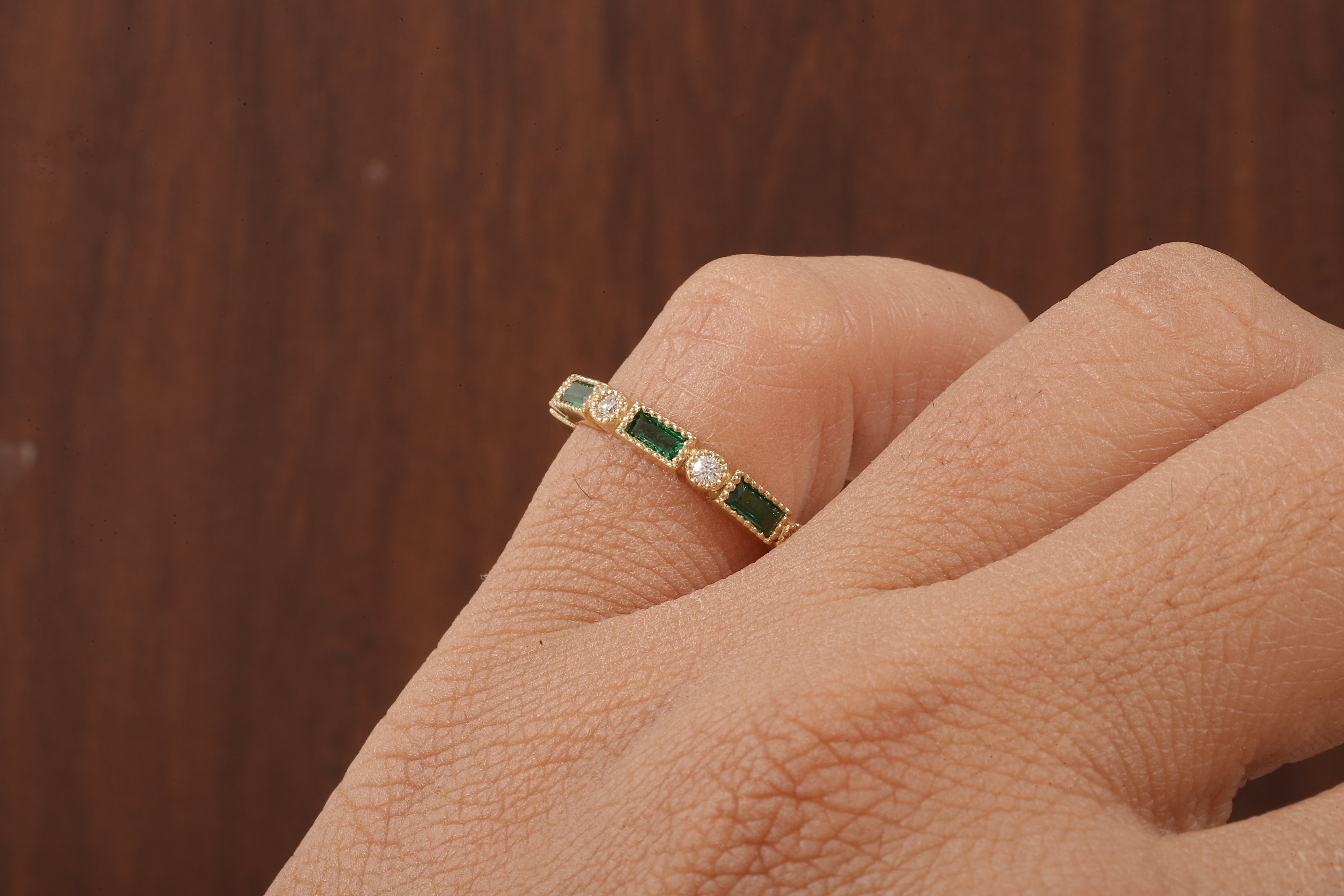 Green baguette and round moissanite milgrain bezel set