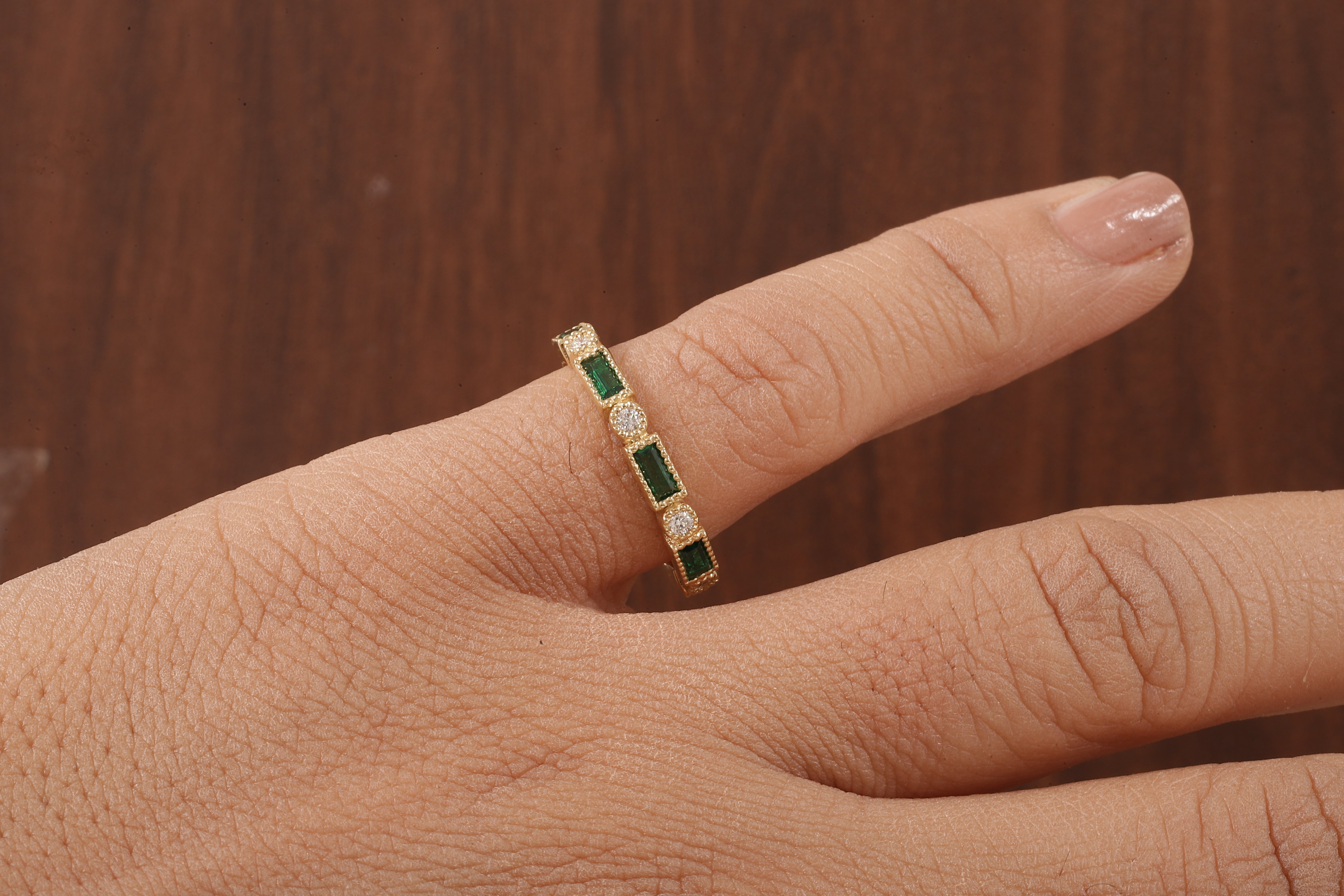 Green baguette and round moissanite milgrain bezel set