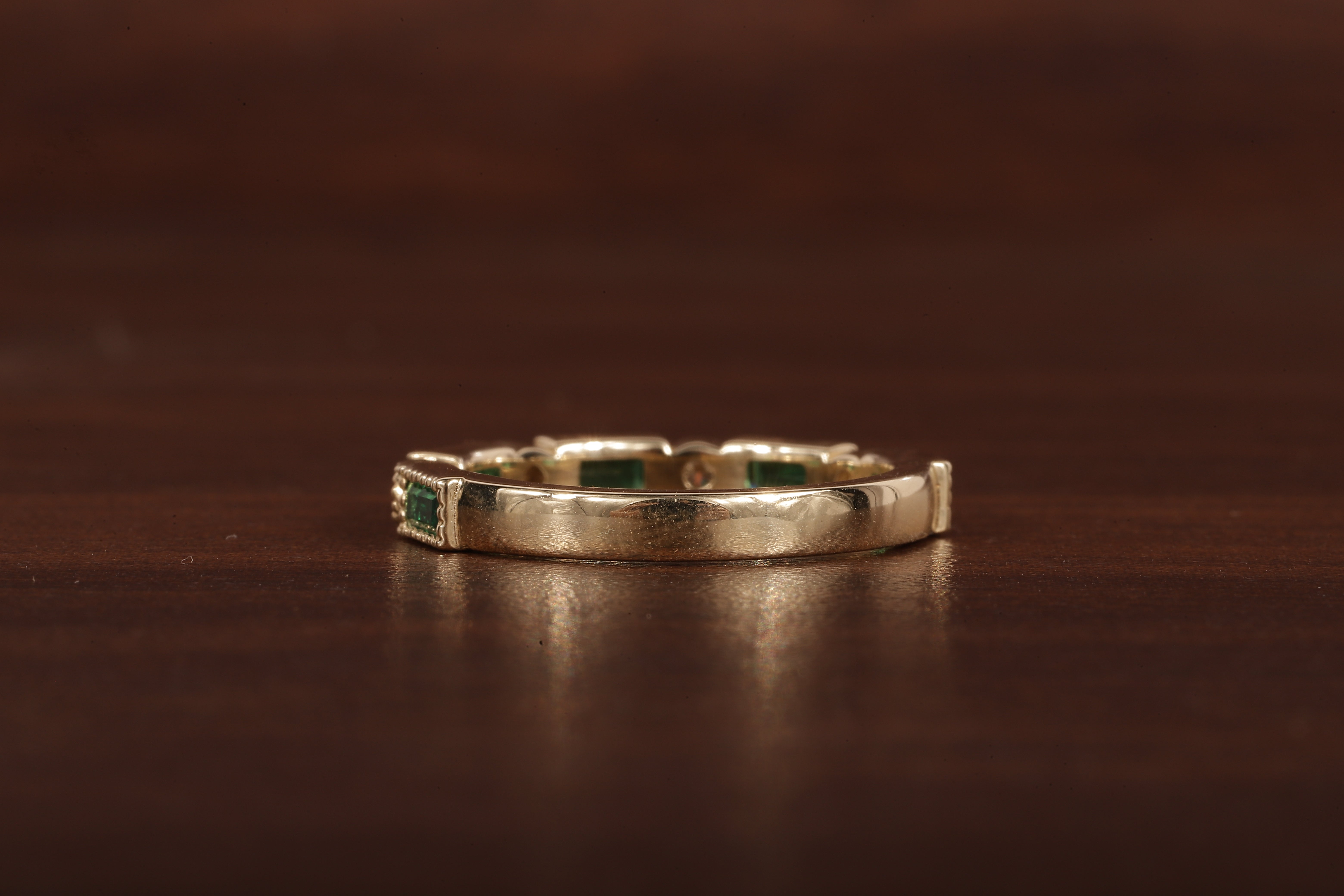 Green baguette and round moissanite milgrain bezel set