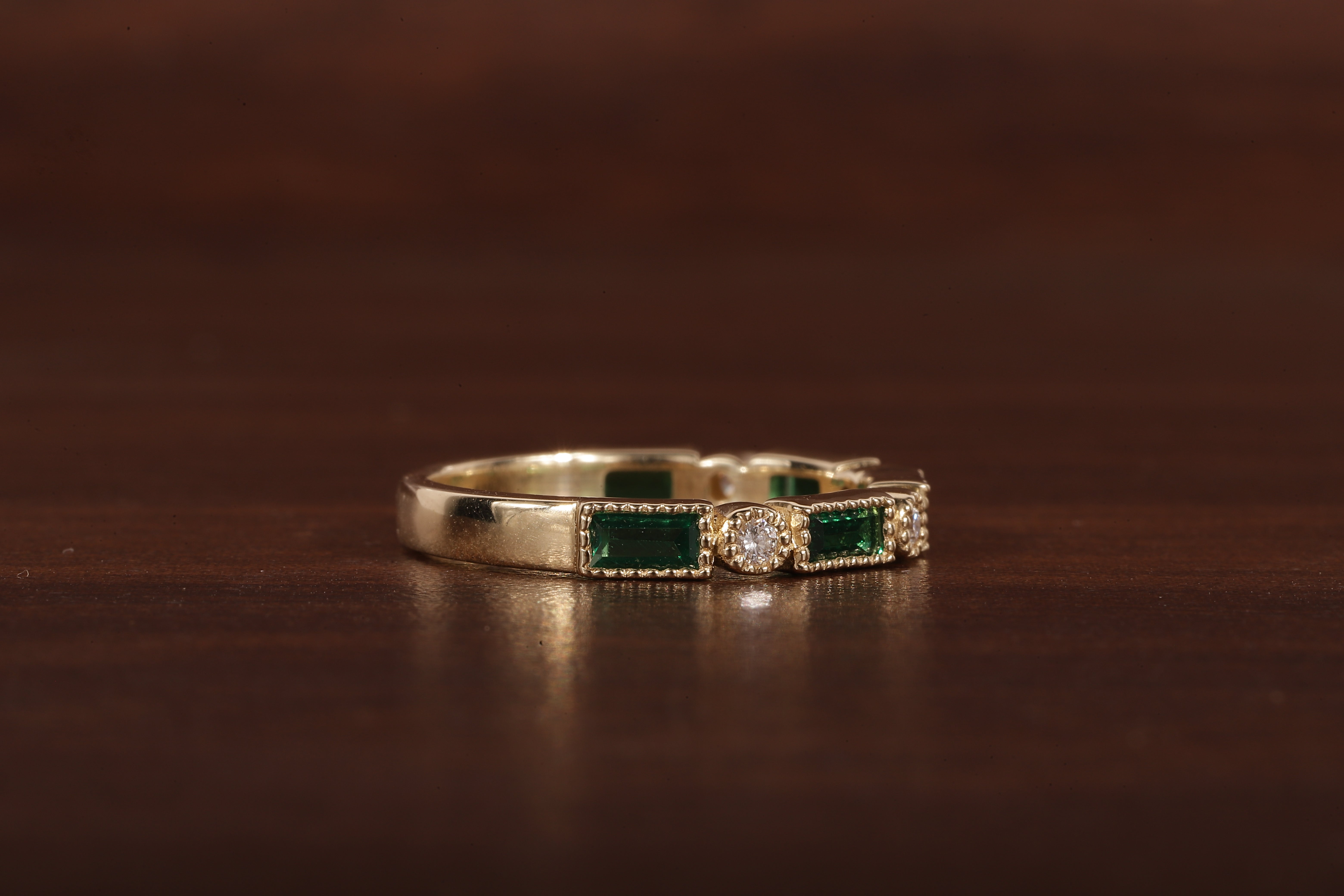 Green baguette and round moissanite milgrain bezel set