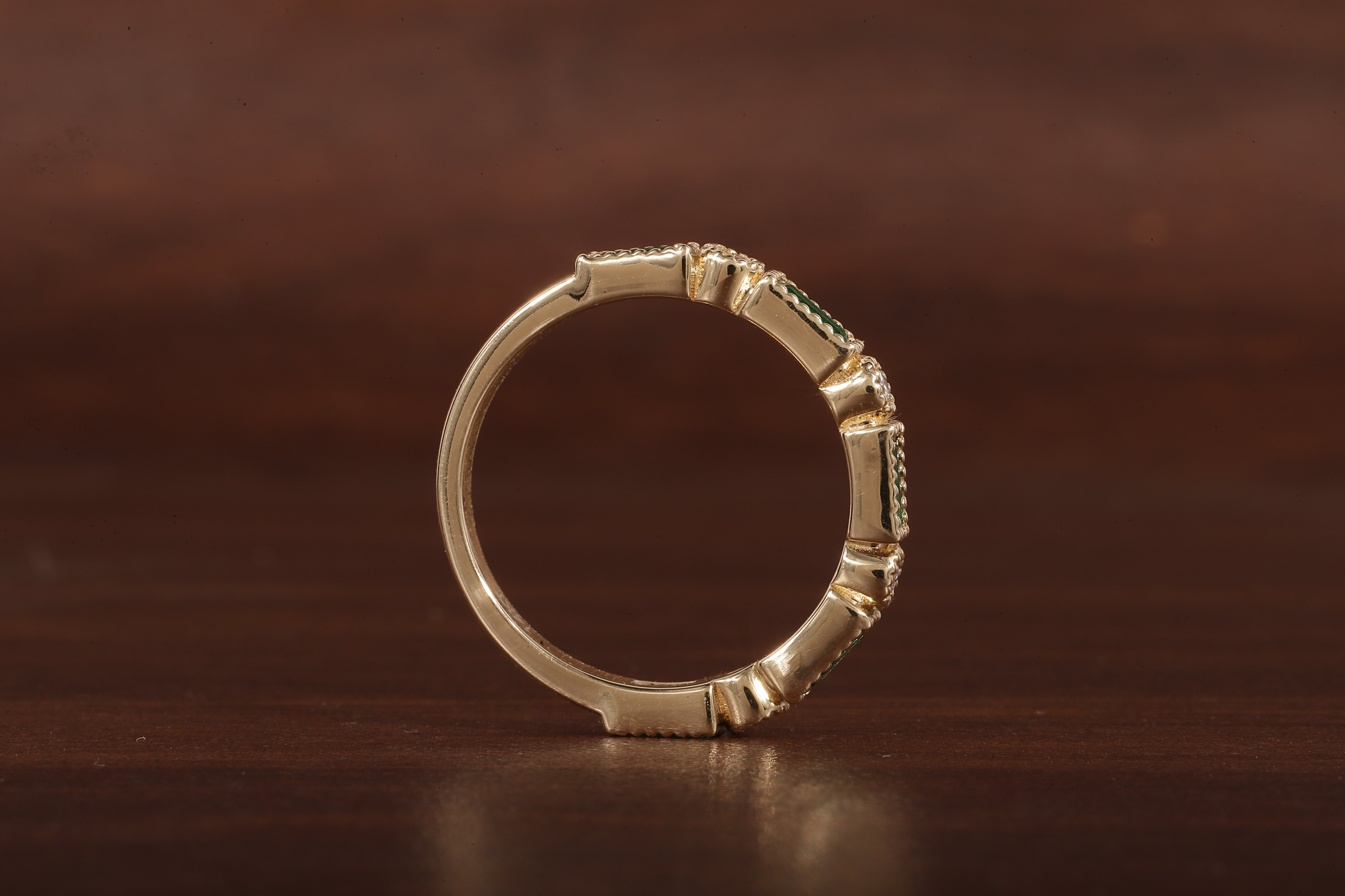 Green baguette and round moissanite milgrain bezel set