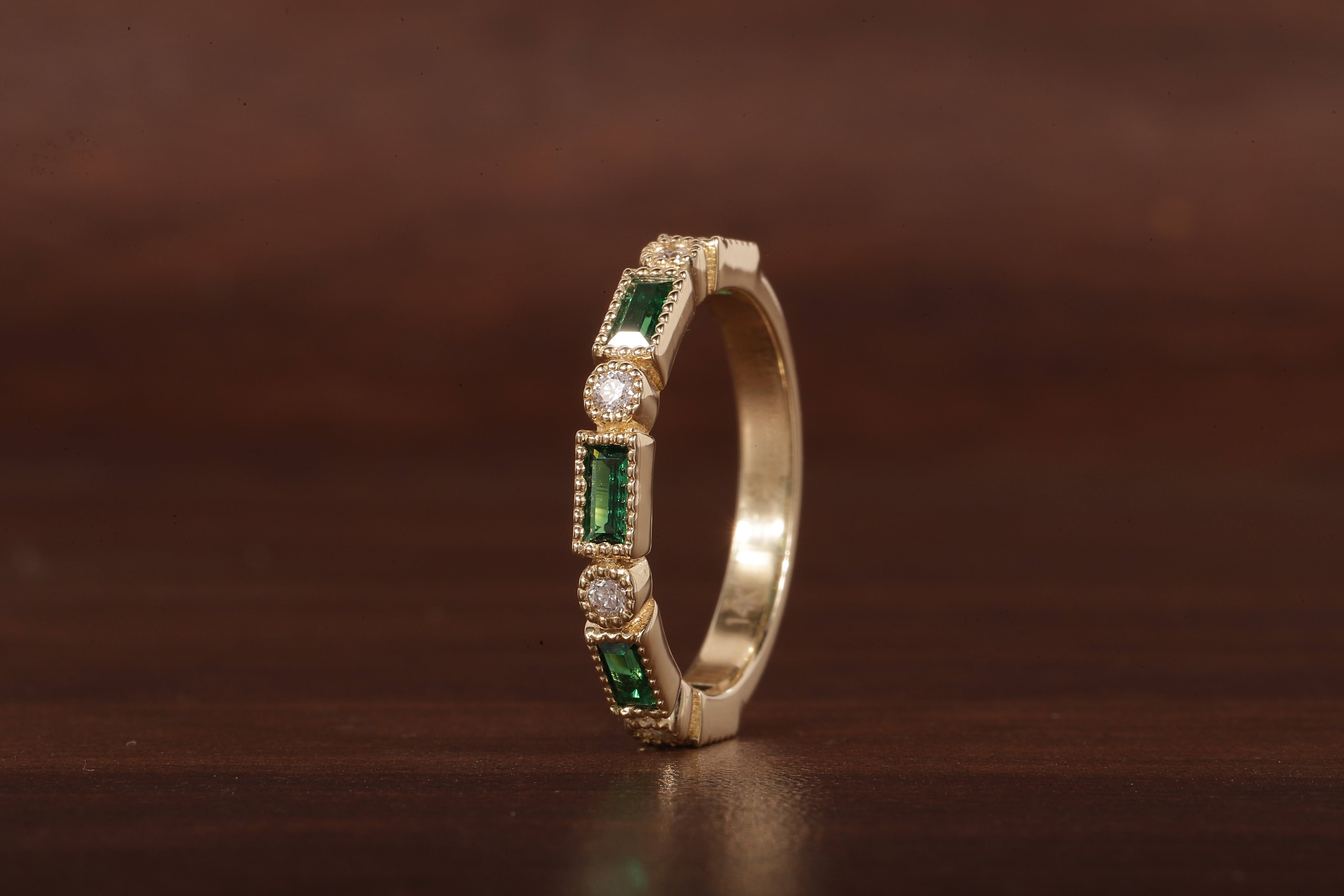 Green baguette and round moissanite milgrain bezel set