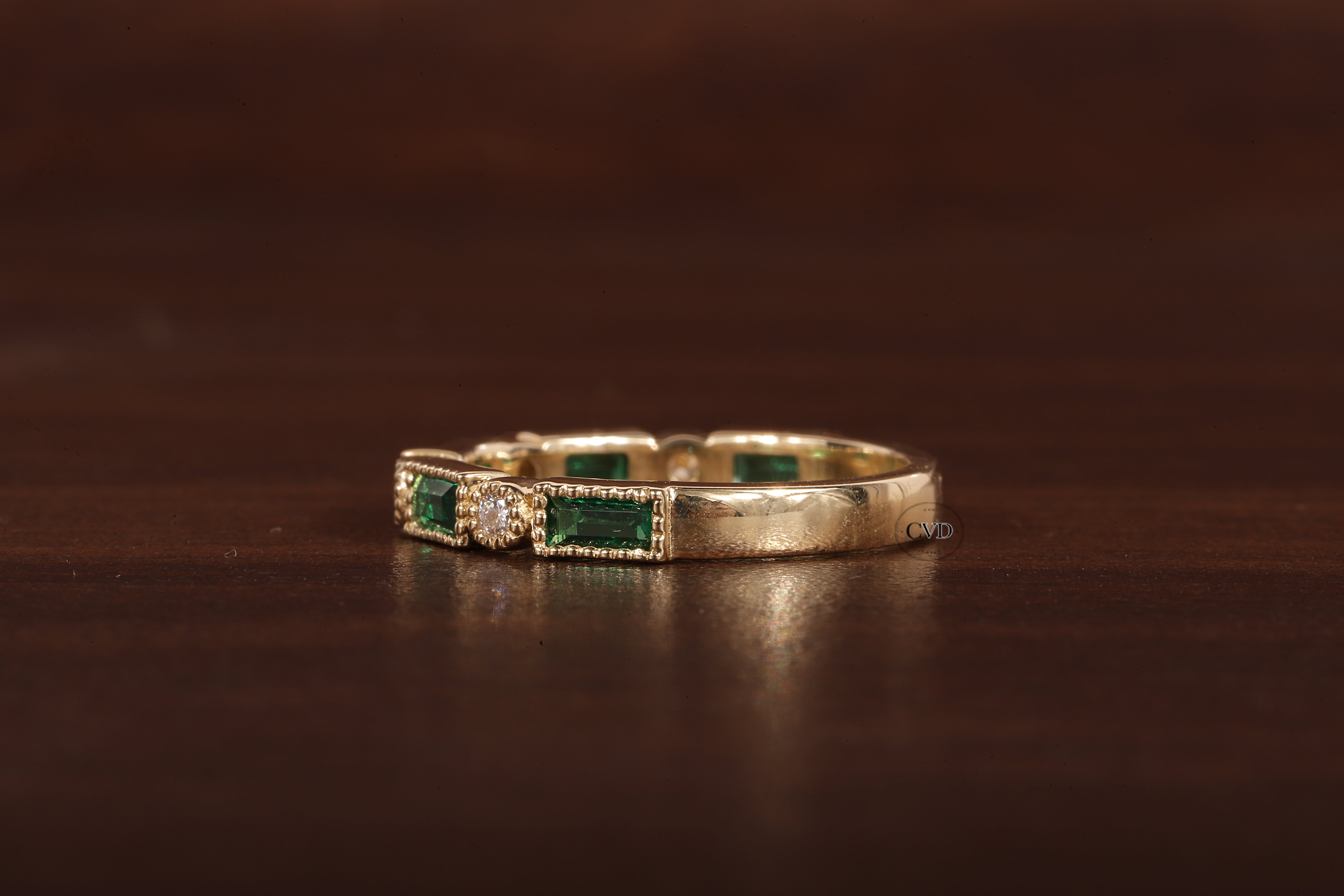 Green baguette and round moissanite milgrain bezel set