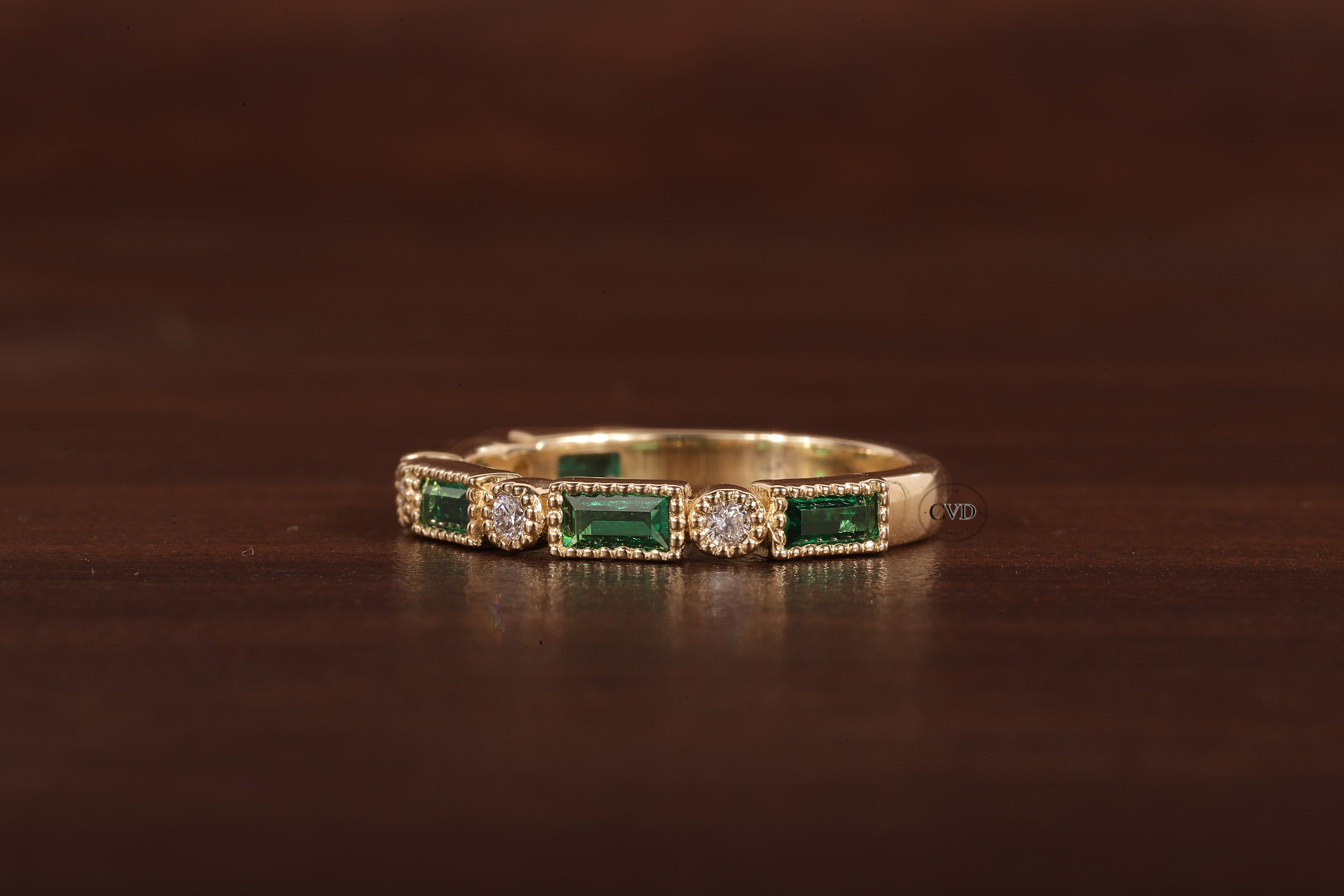 Green baguette and round moissanite milgrain bezel set