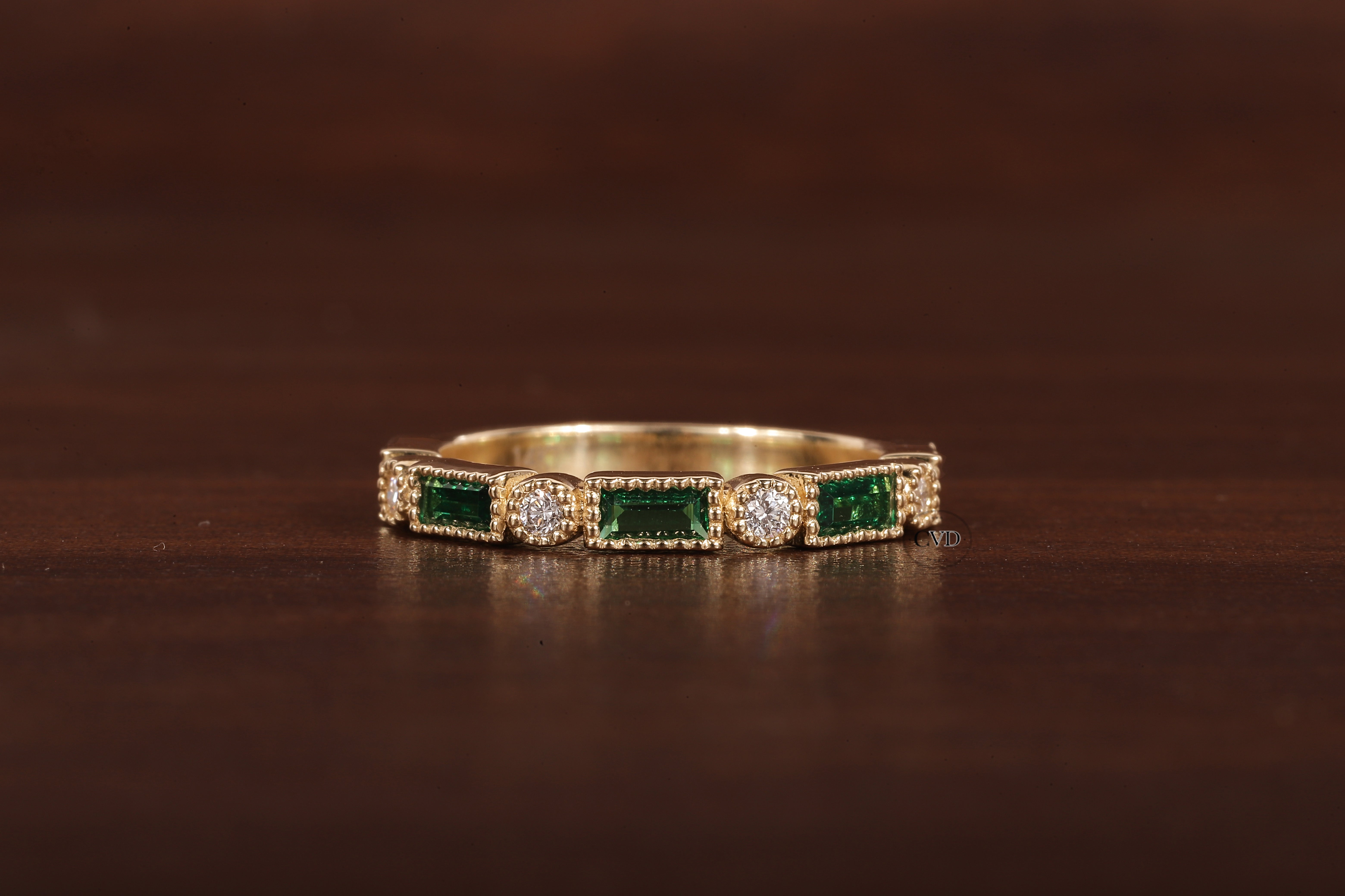 Green baguette and round moissanite milgrain bezel set